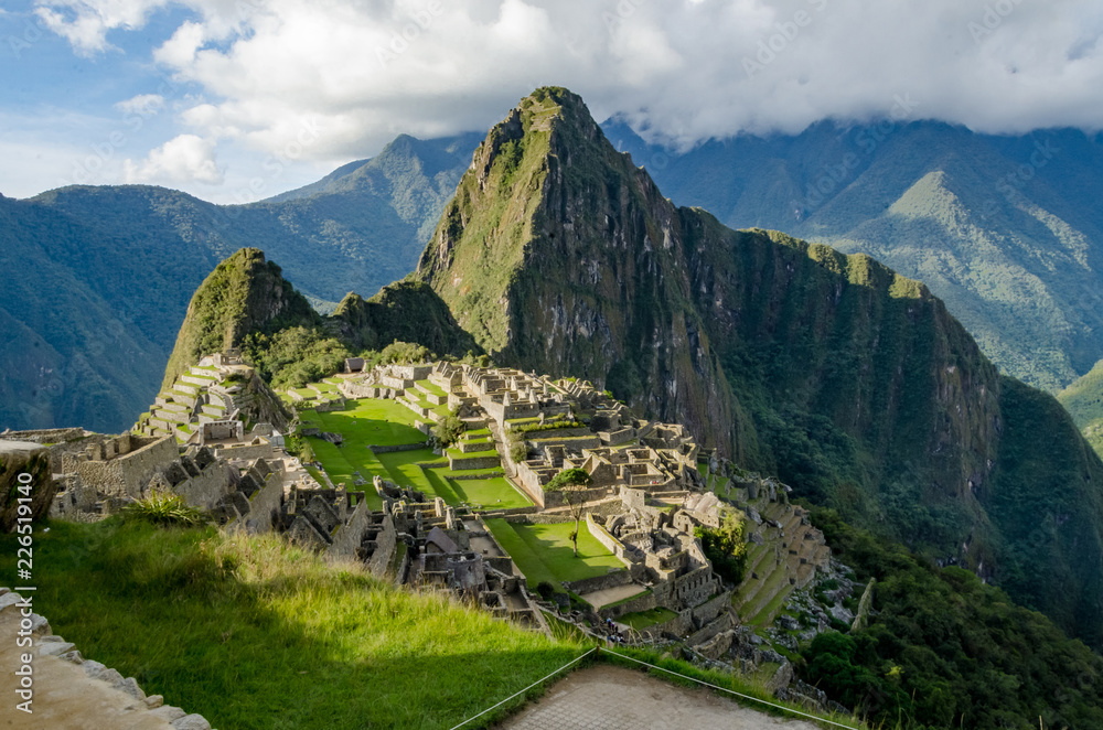 Classic photo of Machu Picchu with the face looking up and the citadel of the Incas, Peru