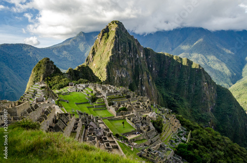 Classic photo of Machu Picchu with the face looking up and the citadel of the Incas, Peru