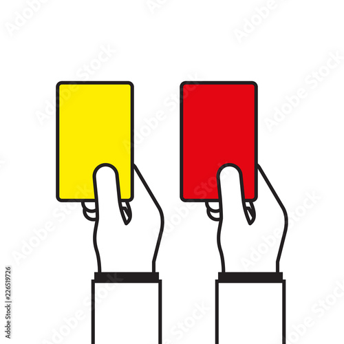 Soccer referees hand with red and yellow card