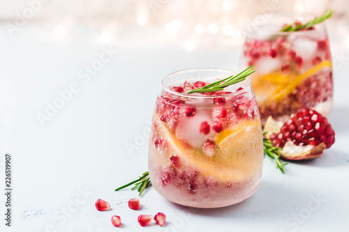 Christmas drinks, citrus, pomegranate cocktail. Selective focus, space for text.