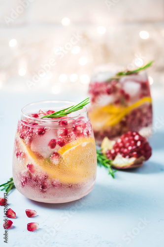 Christmas drinks, citrus, pomegranate cocktail. Selective focus, space for text.