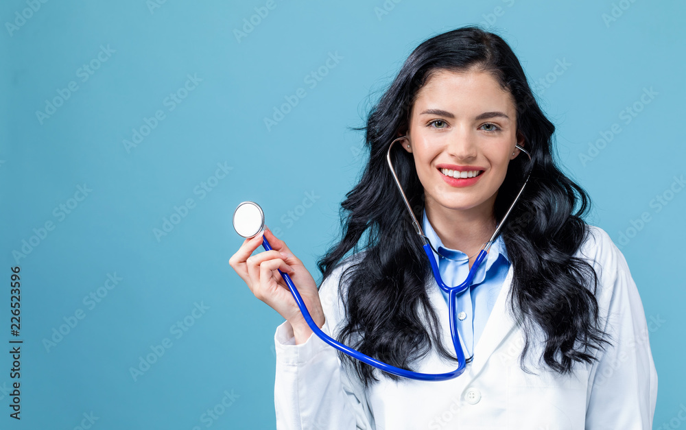 Medical doctor with a stethoscope on a blue background
