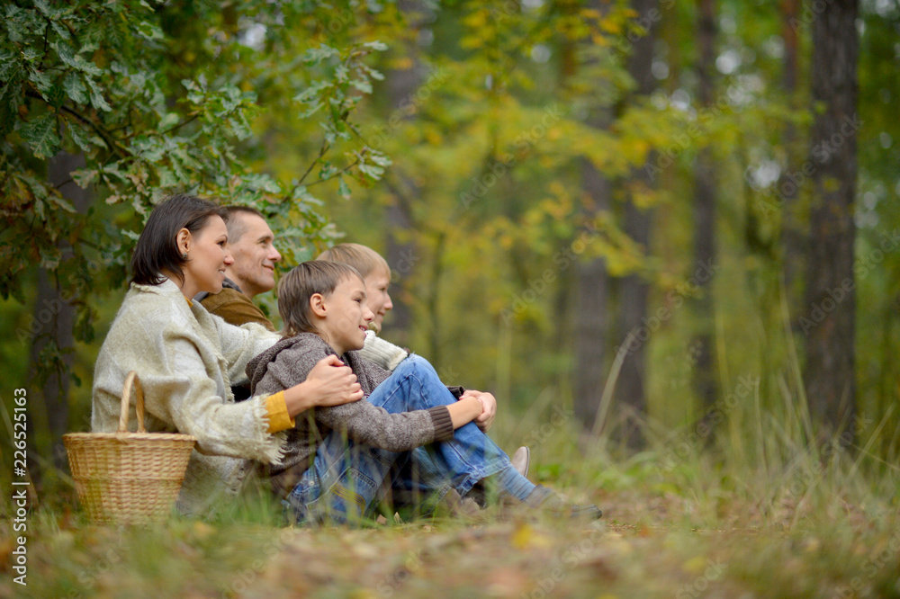 Portrait of a family of four in park Portrait of a family of four in park