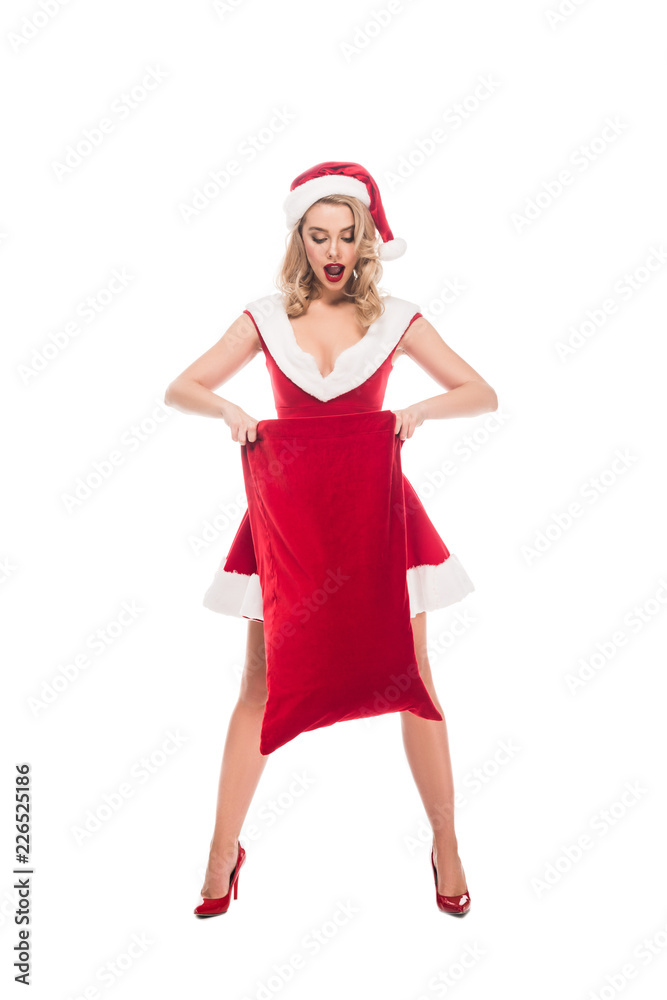 shocked santa girl looking into christmas sack isolated on white shocked santa girl looking into christmas sack isolated on white
