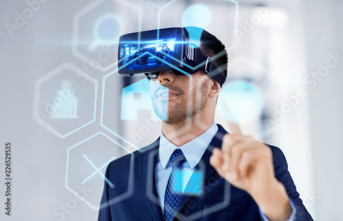 business, technology and augmented reality concept - businessman with vr headset and hologram of menu icons at office