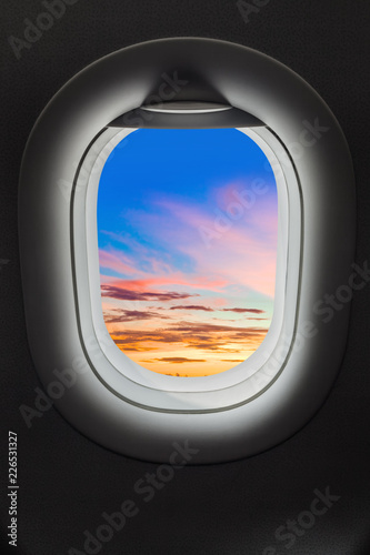 Sunset sky in airplane window