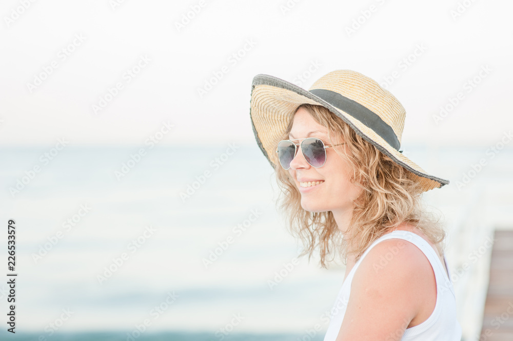 Happy young woman traveling in boat. Smiling woman enjoying cruise