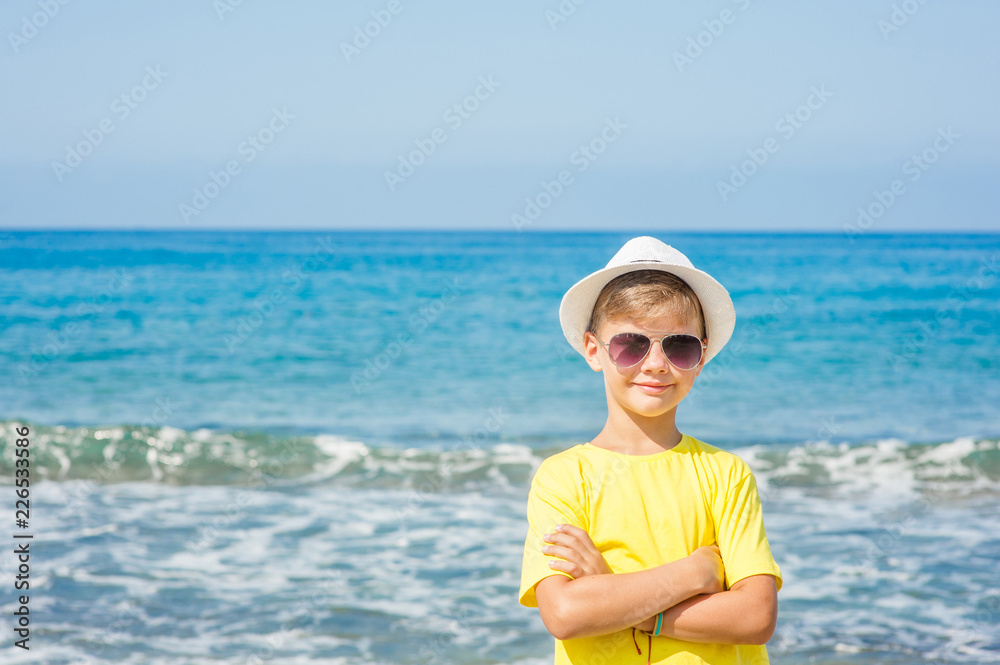 portrait of a boy in a summer hat by the sea portrait of a boy in a summer hat by the sea