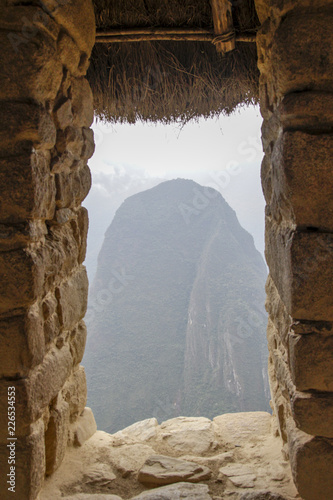 Window on the Machu Pichuu on a cloudy day.