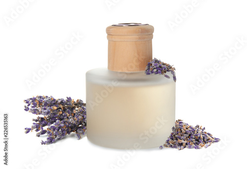 Fototapeta Naklejka Na Ścianę i Meble -  Bottle with aromatic lavender oil on white background