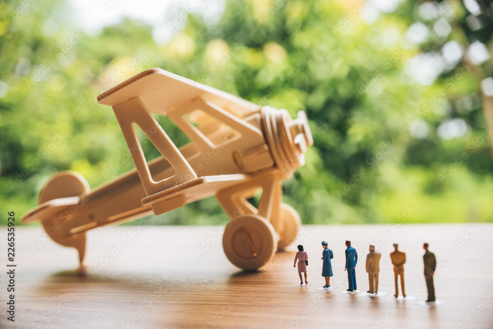 Naklejka premium Retro wooden airplane toy with miniature