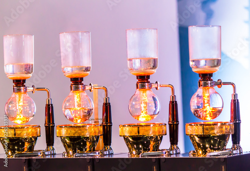 Showcase Syphon Coffee maker by syphonist./ Syphon Coffee or Vacuum Coffee is full immersion tasteful and this picture show boiling water process by Beam heater.