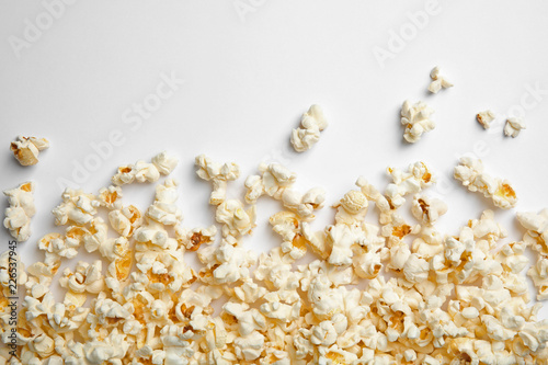 Delicious fresh popcorn on white background, top view