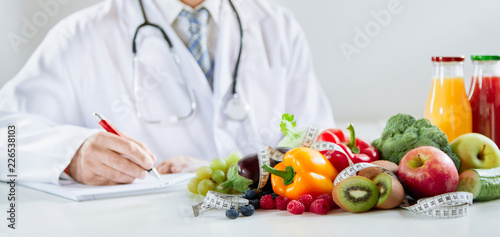 Doctor or dietitian writing a healthy food recipe