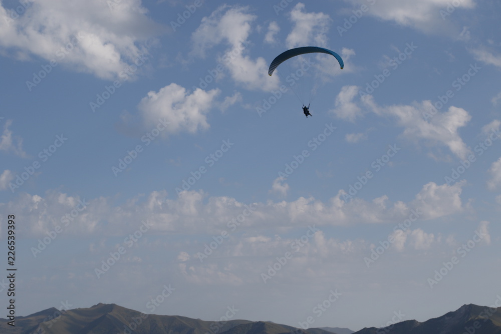 Paragliders into high mountains Paragliders into high mountains