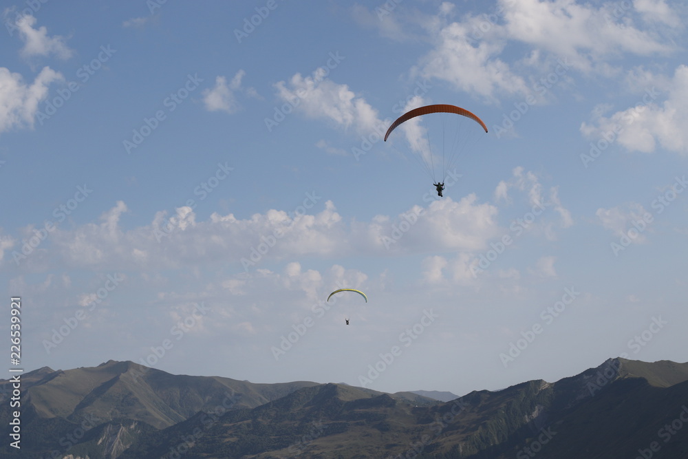 Paragliders into high mountains Paragliders into high mountains