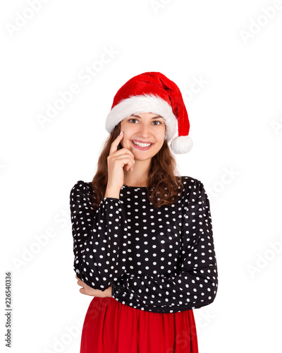 Young beautiful crazy woman in dress portrait. emotional girl in santa claus christmas hat isolated on white background. holiday concept