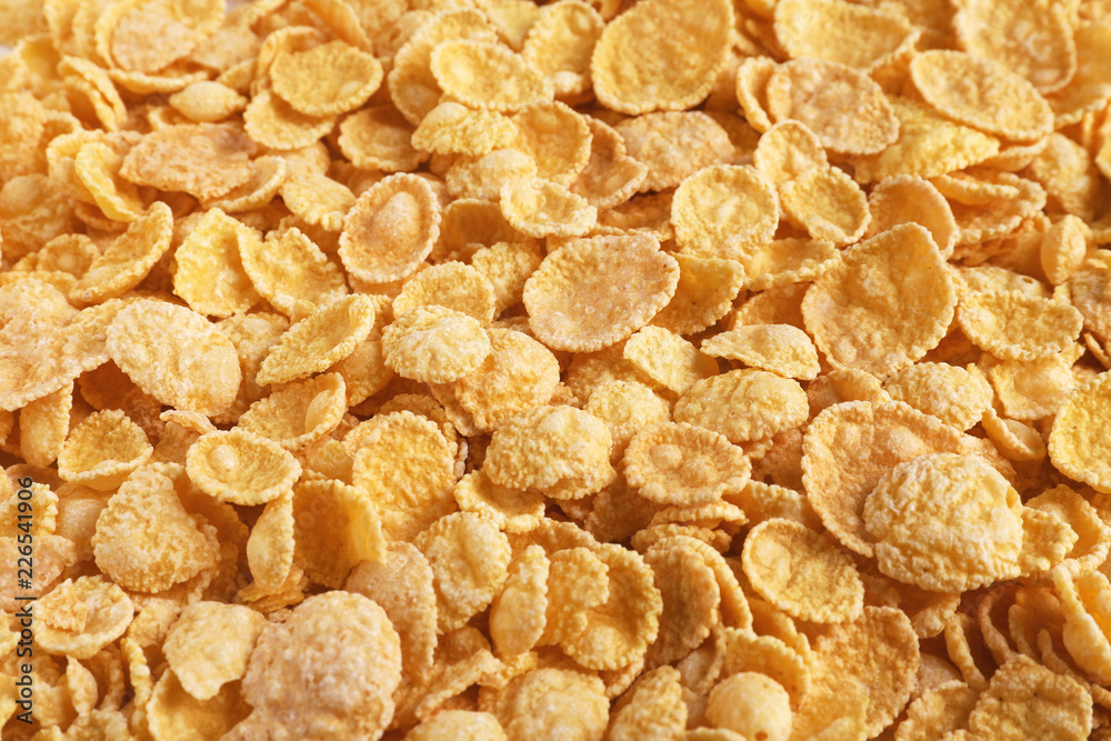 Crispy cornflakes as background, closeup. Healthy breakfast