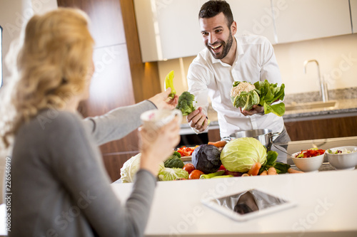 Young couple preparing meal...