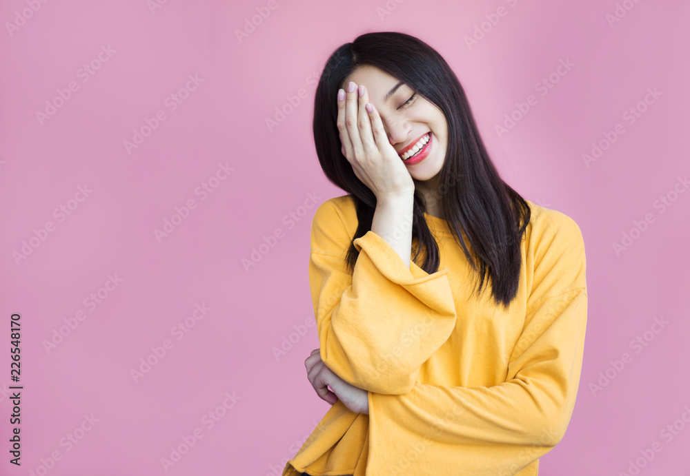 Pretty girl cute laughs in a frame on a pink background. Laughter, joy,  mercy, youth, good joke, emotional reaction, hand covers the face, funny  and friendly, sincerity Stock Photo | Adobe Stock