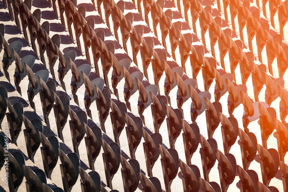Fototapeta premium Pattern of metal folding chairs standing in line