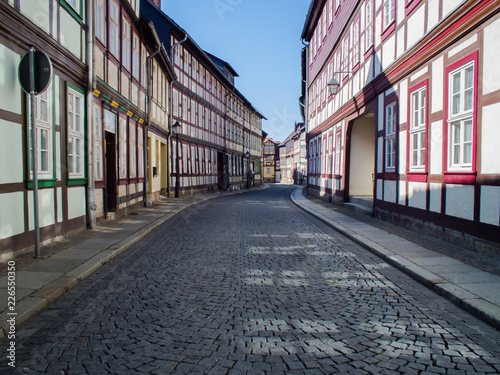 Wernigerode  Germany. Road signs and street lamps on a winding street. Deserted alley in the morning