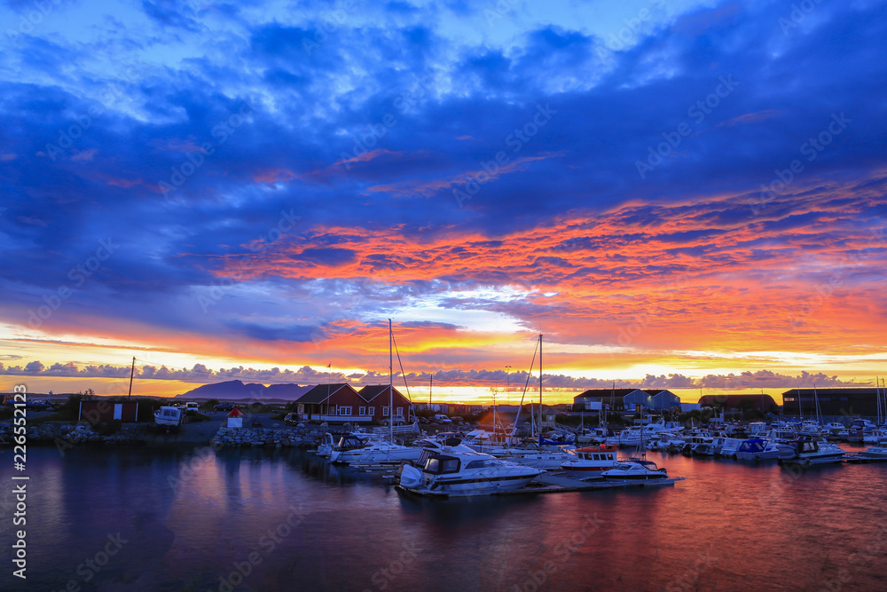 Small boats in the harbor, in beautiful evening sun colors in Bronnoysund Northern Norway