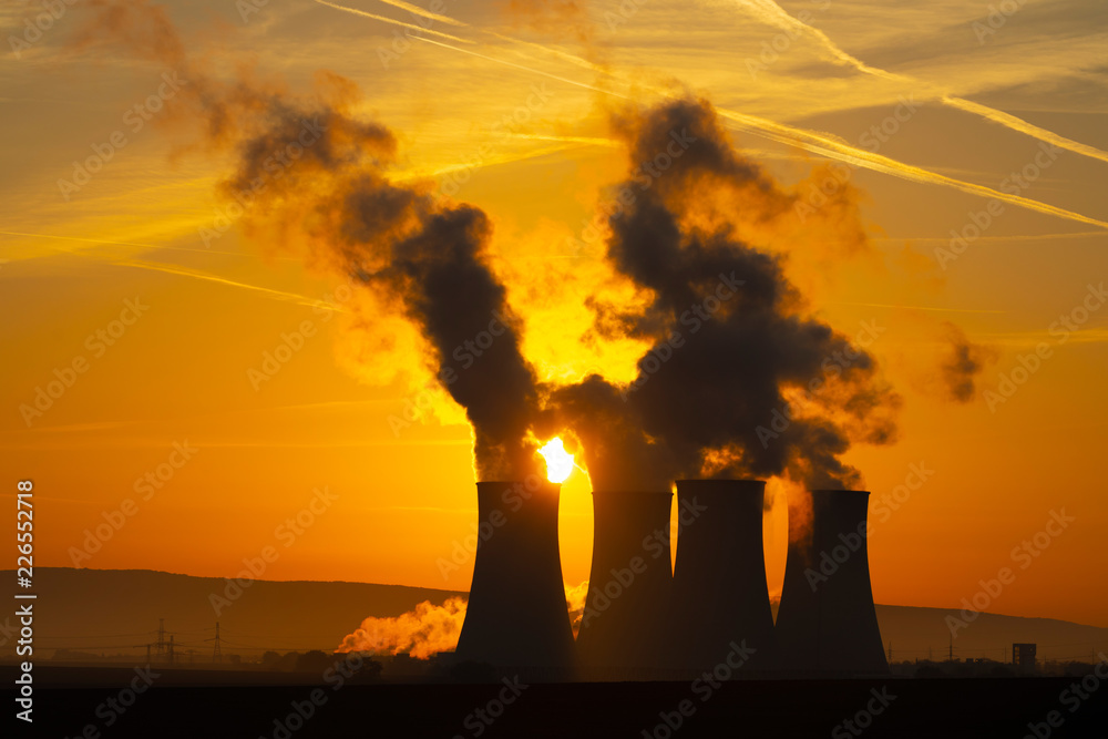 cooling towers of an atomic power plant in the morning sun