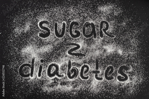 text Sugar - Diabetes on a scattering of sugar crystals, blac