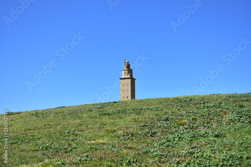 Torre de Hercules on the grass with blue sky. La Coruña, Spain. © JB
