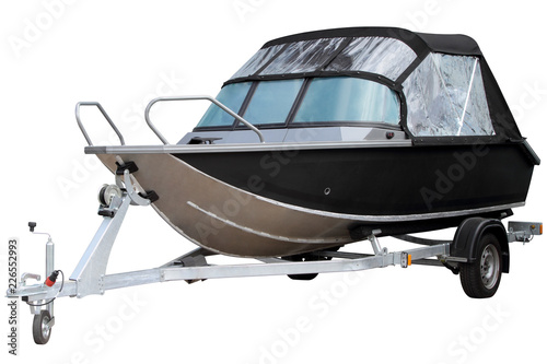 Black motor boat with an awning.