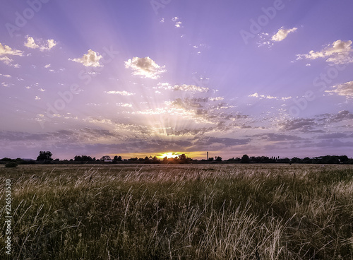 Sunset over Polish fields in Choczewo, Pomerania, Poland. photo