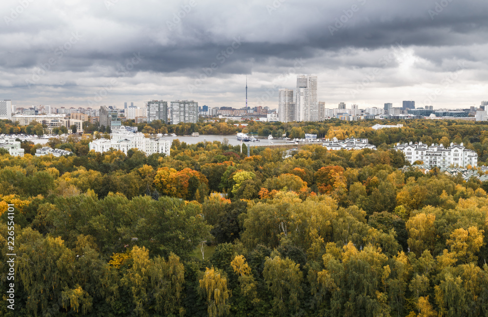 Moscow skyline, panoramic view. Autumn, colorful fall trees in the foreground.