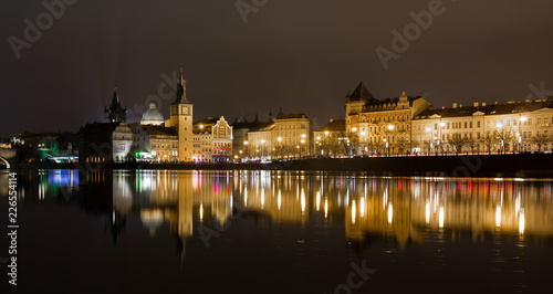 10 December 2017. Prague, Czech. Night Prague city with river and buildings lighted