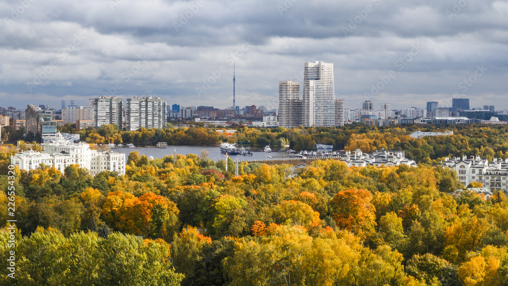 Moscow skyline, panoramic view. Autumn, colorful fall trees in the foreground.