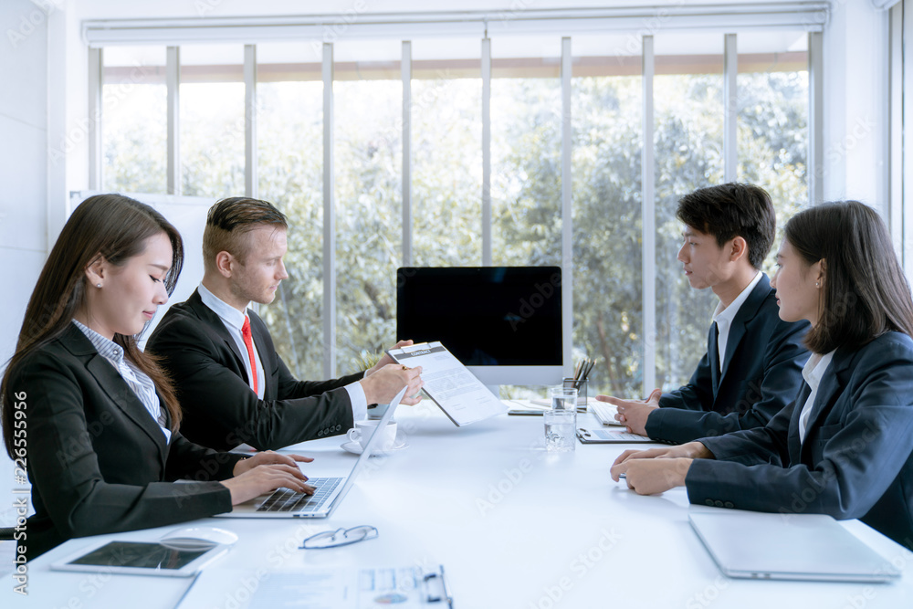 Young business people are presented marketing work project to the customer in meeting room office Young business people are presented marketing work project to the customer in meeting room office