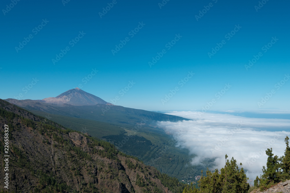 Tenerife mountain landscape,  Pico del Teide summit above clouds