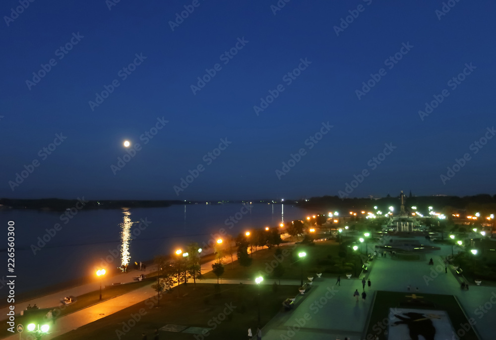 Full moon over the Volga river. Summer night on the arrow of Yaroslavl. Moonlight through the wrought-iron fenceFull moon over the Volga river. Summer night on the arrow of Yaroslavl.