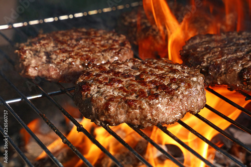 Beef burger for hamburger on barbecue flame grill photo