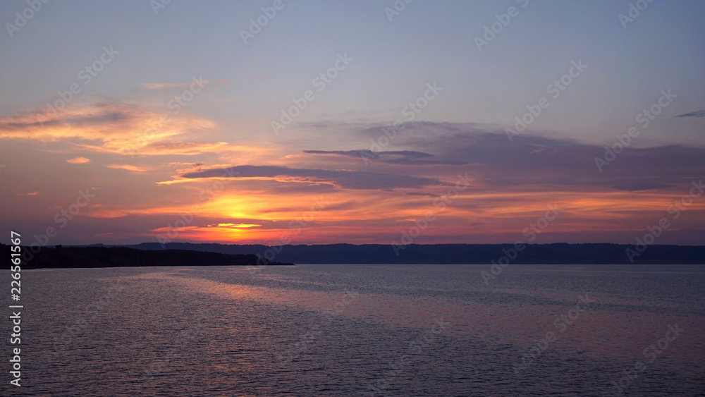 Landscape. Sunset on the river. Evening, beautiful river and sky.
