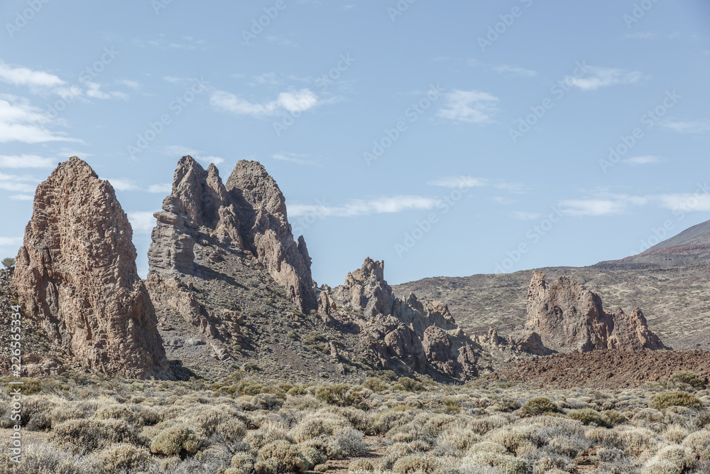 Group of large lava rocks in the middle of a special desert landscape, on a nice sunny day