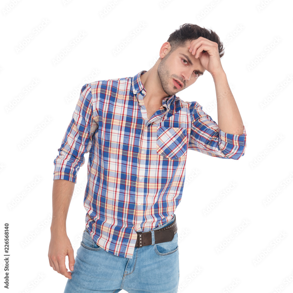 portrait of seductive smart casual man fixing his hair portrait of seductive smart casual man fixing his hair