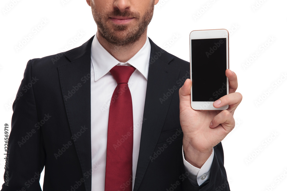 close up of body of businessman presenting mobile phone close up of body of businessman presenting mobile phone