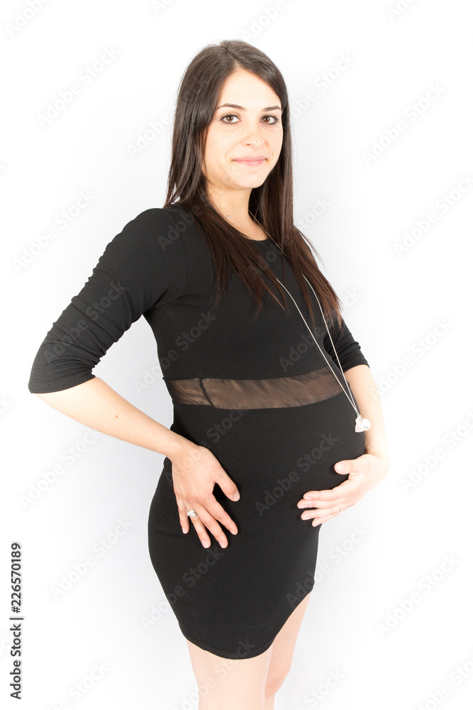 Pregnant woman in black dress isolated over white background Pregnant woman in black dress isolated over white background
