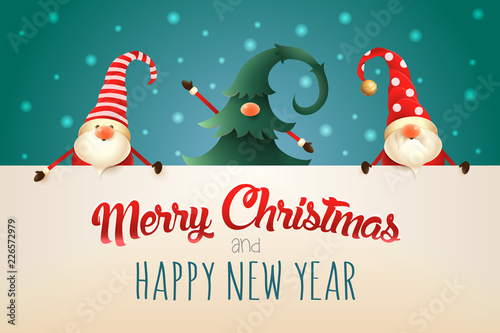Christmas greeting card. Three Christmas Gnomes with signboard on green background. One hidden in Christmas tree