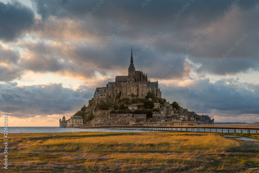 Sunset at Le Mont Saint Michelle in summer at high tide Sunset at Le Mont Saint Michelle in summer at high tide