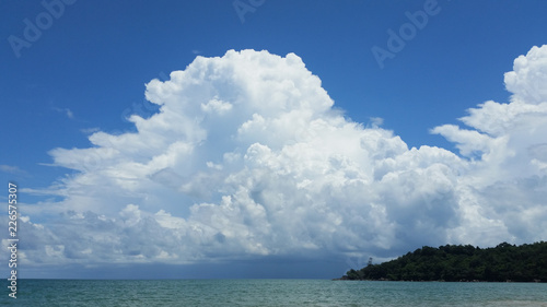 A big, white cloud on the blue sky