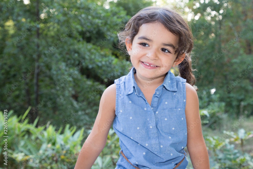 cheerful lifestyle child girl in blue dress smiling happy outdoors cheerful lifestyle child girl in blue dress smiling happy outdoors