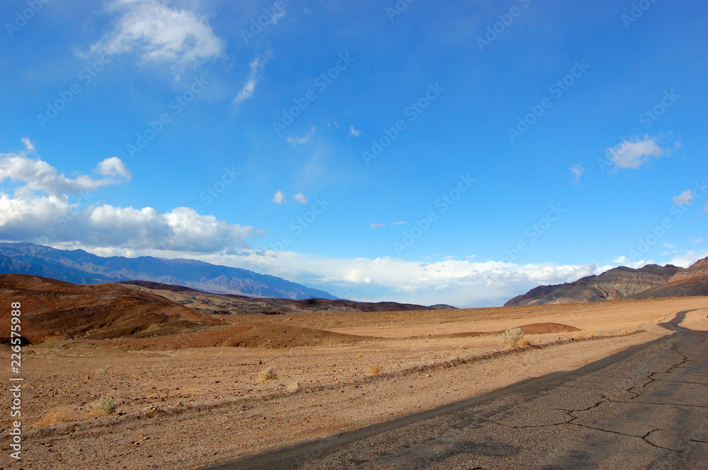 Road in Death Valley National Park on cloudy, California, USA.