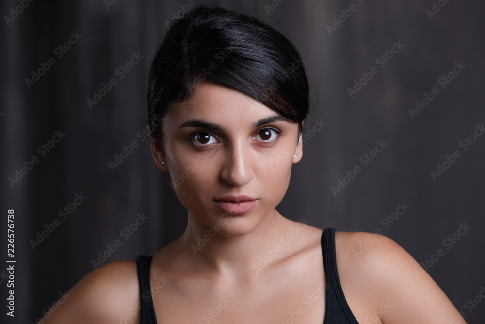 Fototapeta premium Brunette woman face, studio portrait